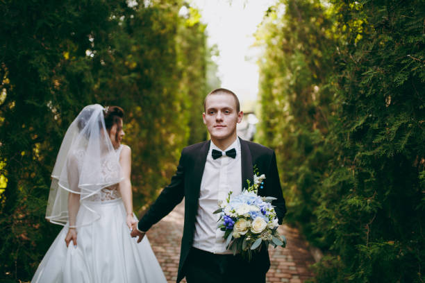 istock Beautiful wedding couple on a walk outdoor 854104236