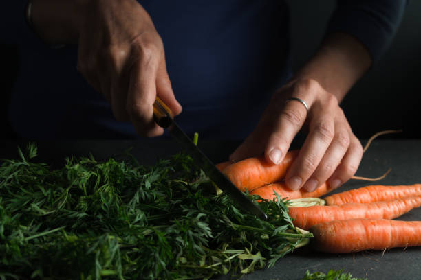 istock Plant, knife in hand, carrot side view 854110366