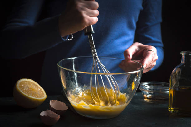 istock Bottle with olive oil, lemon, whipped yolks with mustard 854120340