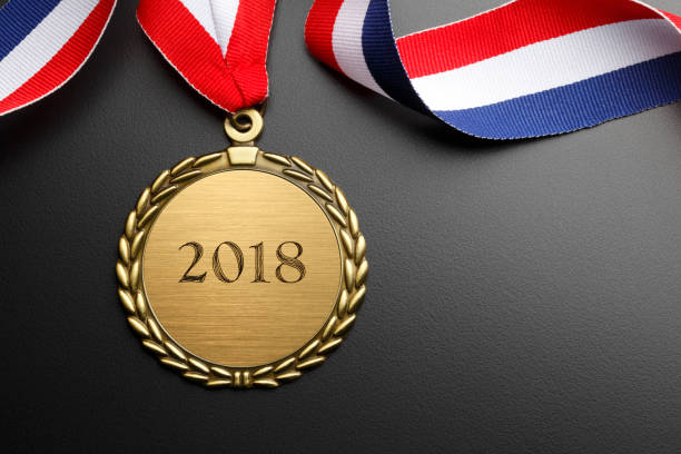 istock Gold Medal Engraved With 2018 On Black Background 854124992
