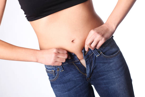 istock Too many calories. Belly is growing. 854125556