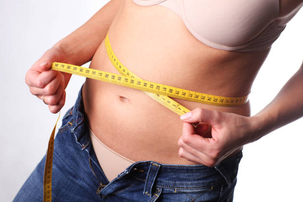 istock Too many calories. Belly is growing. 854125754