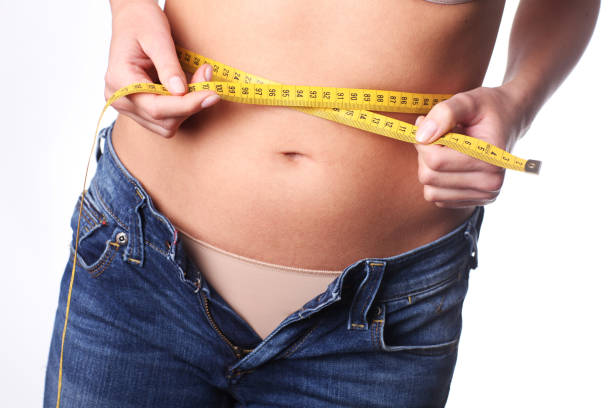 istock Too many calories. Belly is growing. 854129092