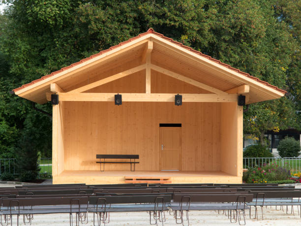Wooden stage with roof and empty benches