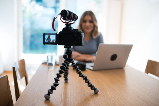 istock Young woman vlogging herself doing business 854156362