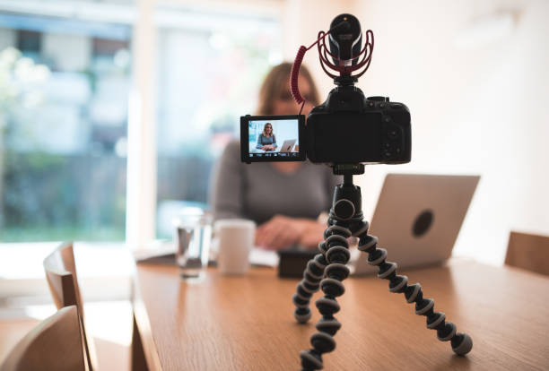 istock Young woman vlogging herself doing business 854156562