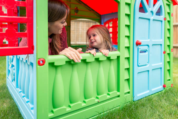 istock Single mother having fun with young daughter on the backyard 854161244