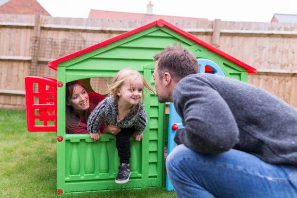 istock Parents having fun with young daughter on the backyard 854161288