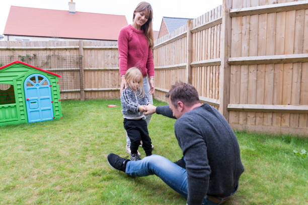 istock Parents having fun with young daughter on the backyard 854161294
