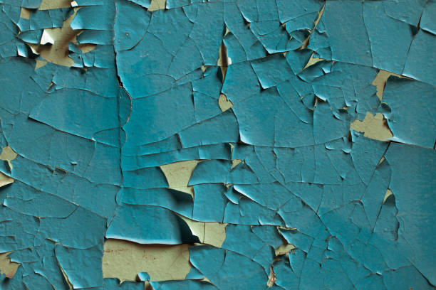 istock Cracked wall with old layers of paint in abandoned house 854162446