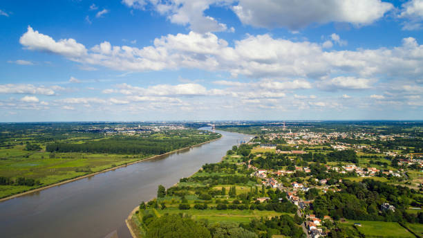Aerial photo of La Loire river in Le Pellerin Aerial view of Le Pellerin, Coueron and Nantes along La Loire river nantes photos stock pictures, royalty-free photos & images