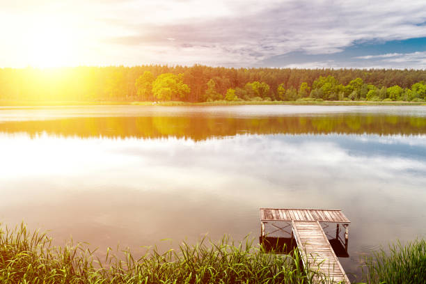 istock Pier on a calm river in the summer 854166414
