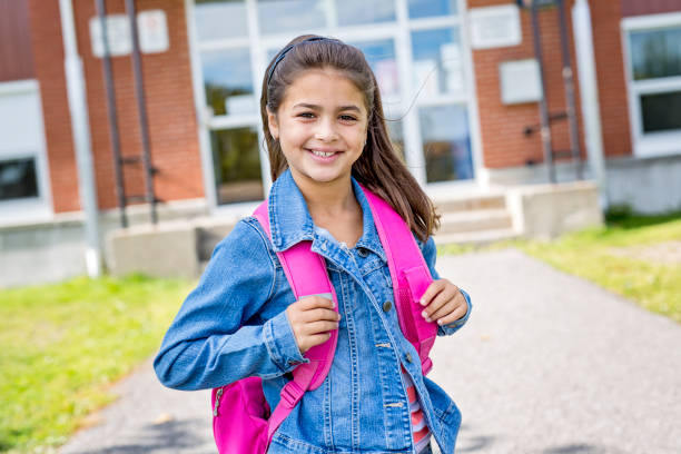 elementary student going back to school An elementary student going back to school first grade classroom stock pictures, royalty-free photos & images
