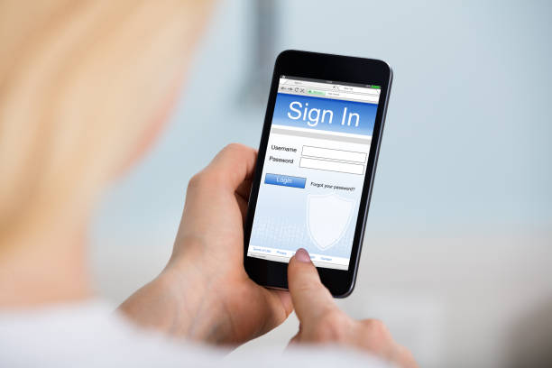 istock Woman Signing Into Website On Mobilephone 854176414