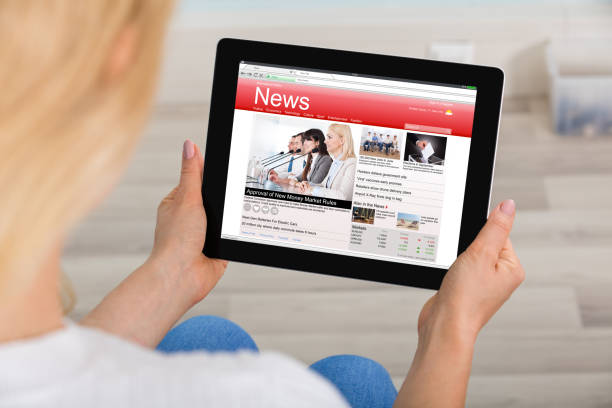 istock Woman Reading News On Digital Tablet 854179752