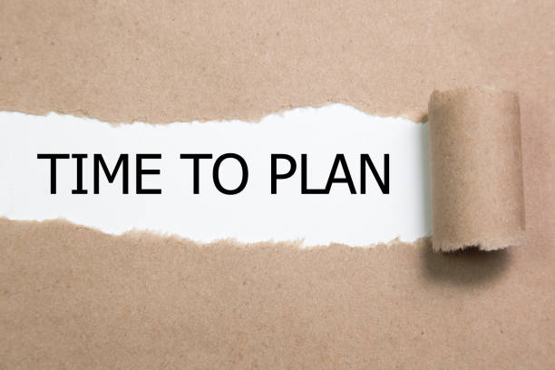 istock The words time to plan appearing behind torn paper 854183570