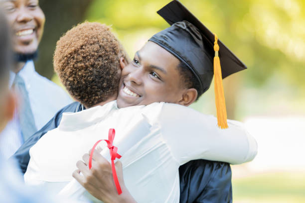 istock Proud mom hugs her son after graduation 854184980