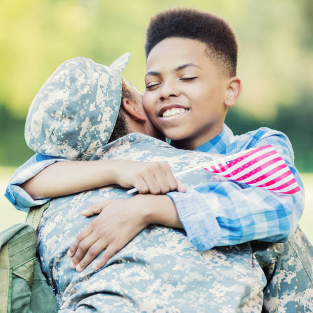 istock Young boy is excited to see his mom after her deployment 854184984