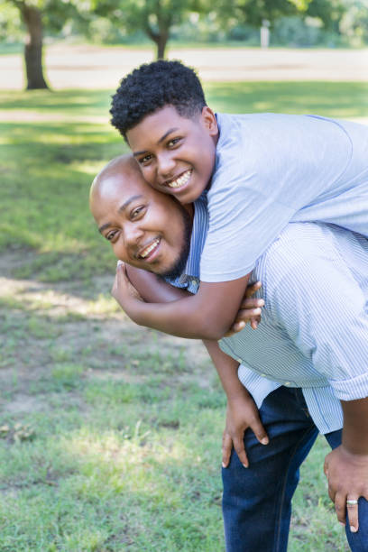 istock Teenage boy enjoys time with his dad 854185106