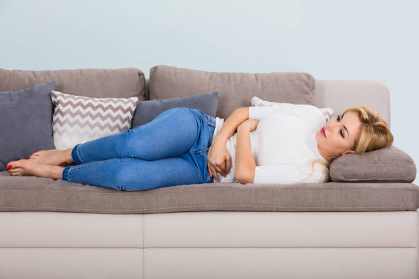 istock Unhappy Woman Suffering From Stomach Ache 854187880