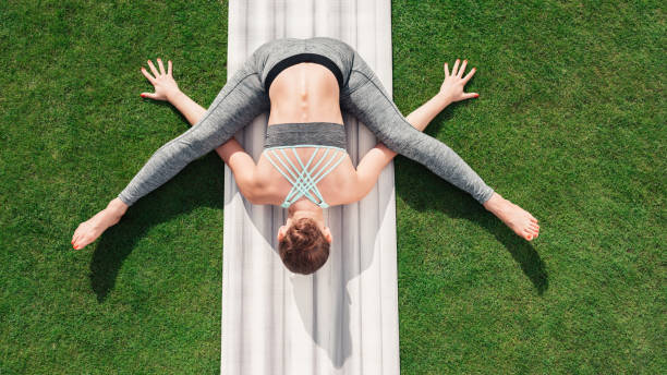 istock woman sitting in yoga pose 854191644
