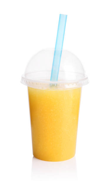 istock Yellow smoothie in plastic transparent cup 854202954