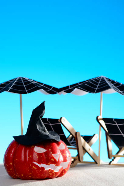 istock Pumpkin and deck chair with umbrella 854205496