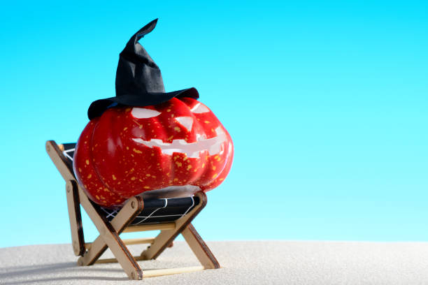 istock Halloween pumpkin on deck chair 854205526