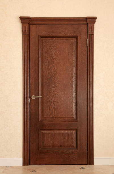istock closed wooden door in the modern room 854212866