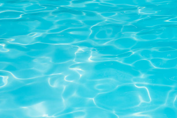 istock Blue and bright ripple water and surface in swimming pool , Beautiful motion gentle wave in pool 854219278