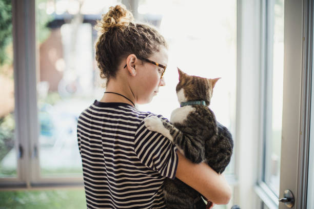 istock A girl holding her cat 854219322