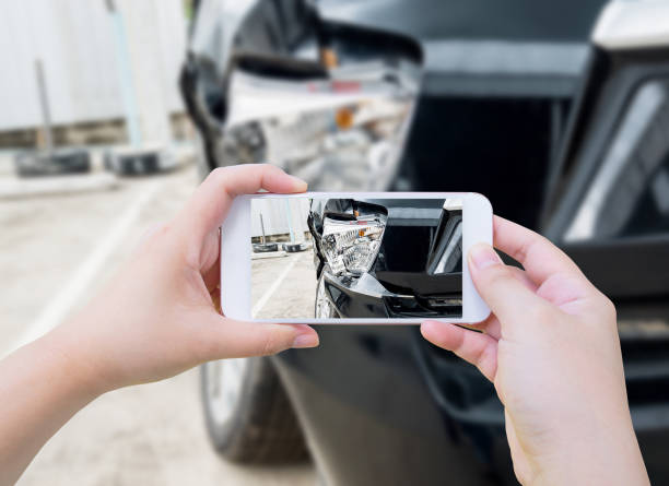 istock female hold mobile smartphone photographing car accident 854219770