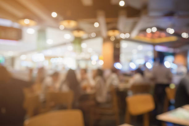 istock People in restaurant cafe interior with bokeh light blurred customer abstract background 854219840