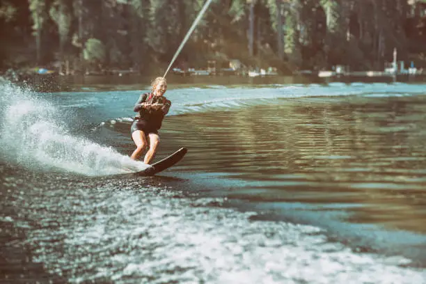 50 year old enjoying waterskiing on a beautiful lake