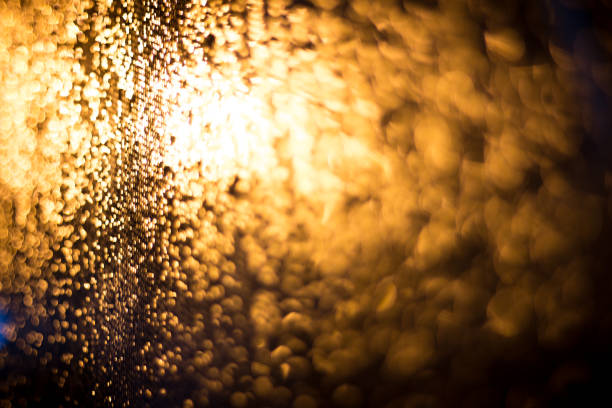 istock Abstract blur background of gold lighting during raining 854222460