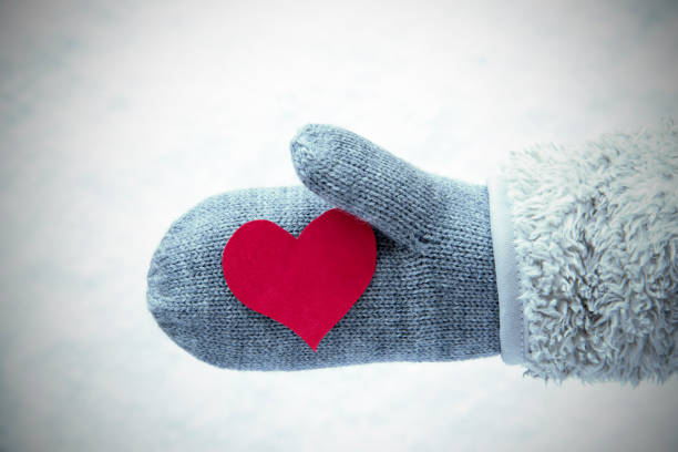 istock Wool Glove With Red Heart, Snow Background 854222558