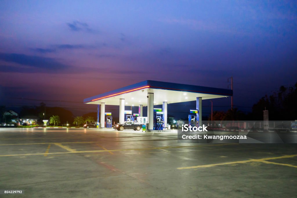 gas station with clouds and sky at sunset Station Stock Photo