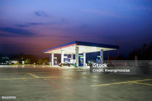 Gas Station With Clouds And Sky At Sunset Stock Photo - Download Image Now - Station, Gas, Fuel and Power Generation