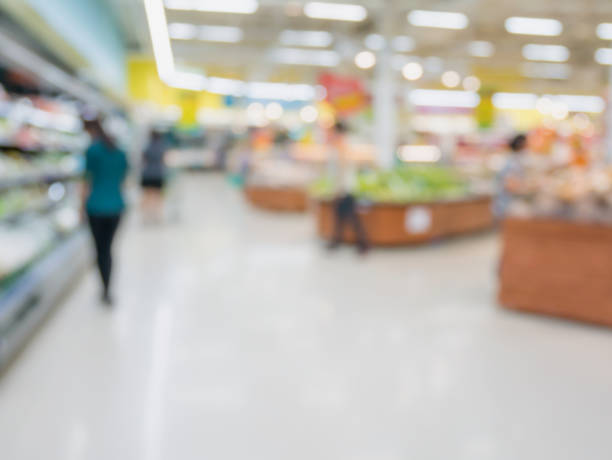 istock Grocery store blur background with customers 854230180