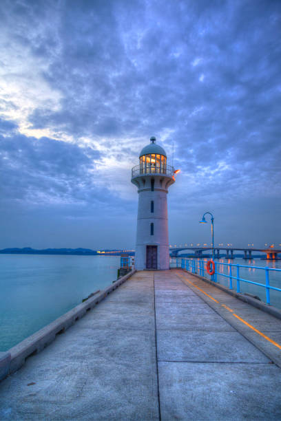 istock Nightfall on Singapore Lighthouse at Tuas 854230900