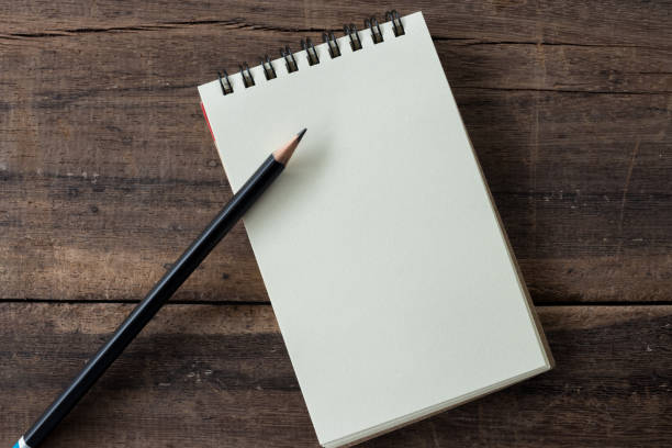 istock Kraft notebook clean and blank diary with pencil  on rustic wood  background. 854234888