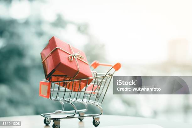 Gift Box In Small Cart About Shopping Online Concept Stock Photo - Download Image Now