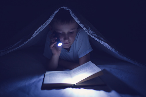 Secret Night Time Reading Stock Photo Download Image Now 8 9 Years Secret Night Time Reading Stock Photo Download Image Now 8 9 Years