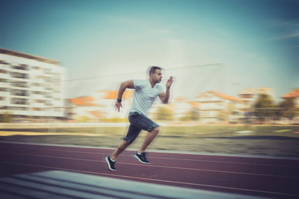 istock Man runinng at the running track 854247604