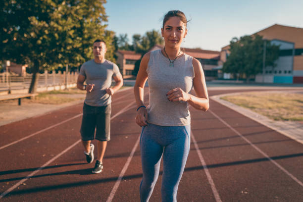 istock Young people running on the running track 854248108