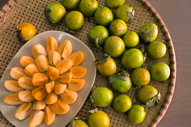 istock Sliced Diospyros kaki (persimmon) on dish 854251540