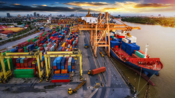 istock Logistics and transportation of Container Cargo ship and Cargo plane with working crane bridge in shipyard at sunrise 854254096