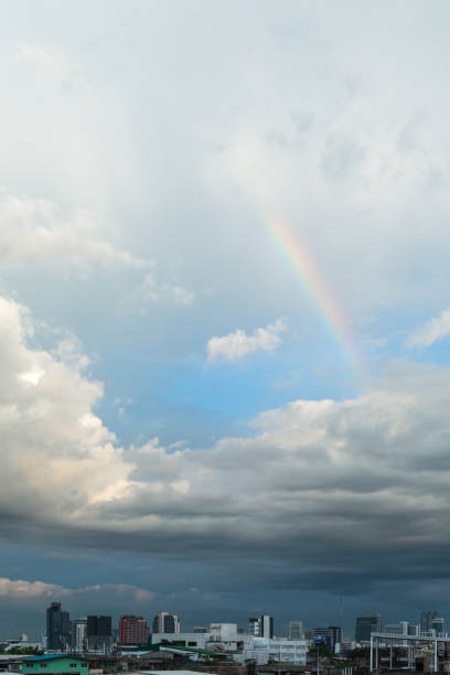 istock Rainbow above the cloudy sky with bangkok city view 854257510
