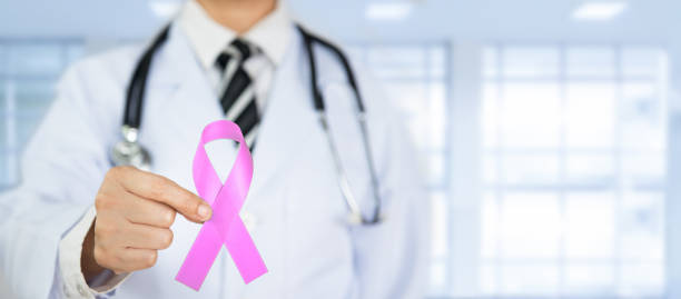 istock Doctor Holds Pink Ribbon 854261932