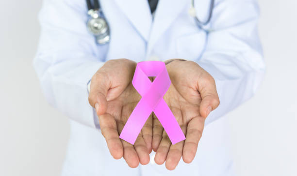 istock Doctor Holds Pink Ribbon 854261948
